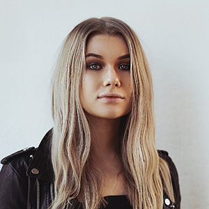 Headshot of blonde woman facing camera