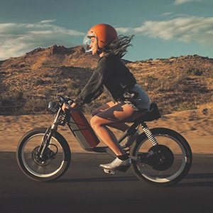 Picture of blonde woman riding motorbike